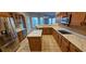 Well-lit kitchen with stainless steel appliances, a center island, and plenty of cabinet space at 5303 Pheasant Dr., North Myrtle Beach, SC 29582