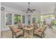 Bright patio with stylish seating, ceiling fan, and backyard view at 5303 Pheasant Dr., North Myrtle Beach, SC 29582