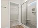 Bathroom with modern shower and view into walk-in closet at 639 Carter Reid Ct., Longs, SC 29568