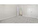Bedroom with neutral paint and carpet, showing doorway and closet at 639 Carter Reid Ct., Longs, SC 29568
