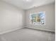 Bedroom with neutral carpet, paint, and a window at 639 Carter Reid Ct., Longs, SC 29568