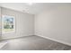 Bedroom with neutral carpet, paint, and a large window at 639 Carter Reid Ct., Longs, SC 29568