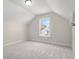Bedroom with neutral carpet, paint, and a large window at 639 Carter Reid Ct., Longs, SC 29568