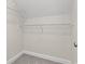 Walk-in closet featuring white wire shelving, neutral paint, and neutral carpet at 639 Carter Reid Ct., Longs, SC 29568