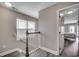 Hallway with luxury vinyl plank flooring, staircase, and bedroom doorway at 113A 12Th Ave. S, Surfside Beach, SC 29575