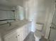 Modern bathroom with white vanity, large mirror, and glass-enclosed shower at 780 Maxine Ct. # 8A, Myrtle Beach, SC 29577