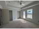 Bedroom with neutral walls, large window and door to outdoor space at 780 Maxine Ct. # 8A, Myrtle Beach, SC 29577