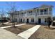 Charming townhome exterior featuring private balconies, stone accents, and well-maintained landscaping at 780 Maxine Ct. # 8A, Myrtle Beach, SC 29577