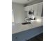 Modern kitchen features white cabinets, stainless steel appliances, and quartz countertops at 780 Maxine Ct. # 8A, Myrtle Beach, SC 29577