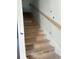 Staircase ready for finishing, featuring wood treads and a simple handrail at 780 Maxine Ct. # 8A, Myrtle Beach, SC 29577