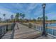 Scenic community park featuring a charming pier with lampposts, offering picturesque lakeside views and relaxation at 821 Rebecca Ln. # 6C, Myrtle Beach, SC 29577