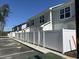 Row of new construction townhomes with white fences and ample parking spaces available at 821 Rebecca Ln. # 6C, Myrtle Beach, SC 29577