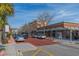 Lively street view showcasing the retail shops with ample parking, set against a beautiful blue sky at 821 Rebecca Ln. # 6C, Myrtle Beach, SC 29577