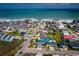Aerial view of coastal neighborhood with colorful houses, lush greenery, and convenient beach access at 526 Dogwood Dr. N, Garden City Beach, SC 29576