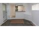 Finished basement area with sink, cabinets, and an open doorway at 526 Dogwood Dr. N, Garden City Beach, SC 29576