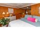 Bedroom with wood wall accents, soft lighting, and comfortable bedding at 526 Dogwood Dr. N, Garden City Beach, SC 29576