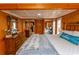This bedroom features rich wood paneling, large windows, and ample closet space at 526 Dogwood Dr. N, Garden City Beach, SC 29576