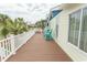 Outdoor deck with seating, offering a relaxing space with palm tree views at 526 Dogwood Dr. N, Garden City Beach, SC 29576