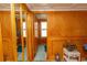 Inviting entryway featuring wood walls, mirrored closet, and tasteful decorations at 526 Dogwood Dr. N, Garden City Beach, SC 29576