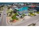Stunning coastal home featuring vibrant colors, lush landscaping, and multiple decks for enjoying ocean views at 526 Dogwood Dr. N, Garden City Beach, SC 29576