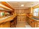 Open kitchen featuring wood cabinets, countertop seating, and stainless steel appliances at 526 Dogwood Dr. N, Garden City Beach, SC 29576
