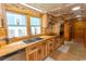 Natural light streams into the kitchen highlighting wooden counters and stainless steel appliances at 526 Dogwood Dr. N, Garden City Beach, SC 29576