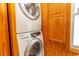 Convenient laundry area with a stacked washer and dryer at 526 Dogwood Dr. N, Garden City Beach, SC 29576