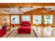 Spacious living area with wood paneling, hardwood floors, and a coffered ceiling for an elegant look at 526 Dogwood Dr. N, Garden City Beach, SC 29576