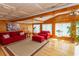 Bright living room with wood accents, a coffered ceiling, and large windows offering natural light at 526 Dogwood Dr. N, Garden City Beach, SC 29576