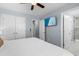 The bedroom includes a TV, closet and doorways into the en suite bathroom and another room in the house at 514 Vista Dr., Murrells Inlet, SC 29576
