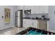 Wet bar with stainless appliances, white cabinets, granite counters and access to backyard at 514 Vista Dr., Murrells Inlet, SC 29576