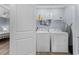 A laundry room with shelving, storage, washer and dryer inside of a closet in the home at 514 Vista Dr., Murrells Inlet, SC 29576