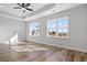 Bright, light-filled bedroom with wood floors, a modern ceiling fan, recessed lighting and a pretty landscape view at 132 Oak Bay Dr., Georgetown, SC 29440