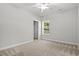 Cozy bedroom with neutral carpet, a ceiling fan, a window and a closet for comfortable living at 132 Oak Bay Dr., Georgetown, SC 29440