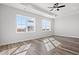 Bright, light-filled bedroom with wood floors, a modern ceiling fan, recessed lighting and a water view at 132 Oak Bay Dr., Georgetown, SC 29440