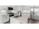 Kitchen featuring white cabinets, stainless steel appliances, stone countertops, and modern fixtures at 132 Oak Bay Dr., Georgetown, SC 29440