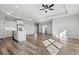 Open-concept living area with recessed lighting, ceiling fan, wood floors, and bright, neutral paint at 132 Oak Bay Dr., Georgetown, SC 29440