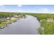 Waterfront homes and lush greenery; wide waterway view at 2201 John Henry Ln., Myrtle Beach, SC 29579
