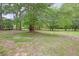 Spacious backyard with large trees and grassy area at 2201 John Henry Ln., Myrtle Beach, SC 29579