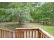 Spacious backyard with lush trees and a wooden deck at 2201 John Henry Ln., Myrtle Beach, SC 29579