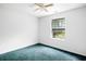 Bedroom with teal carpet and a window offering natural light at 2201 John Henry Ln., Myrtle Beach, SC 29579