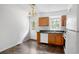 Kitchen boasts wood cabinets, a dishwasher, and a back door to outside at 2201 John Henry Ln., Myrtle Beach, SC 29579