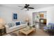 Living room features a white couch, coffee table, and view into the kitchen at 2201 John Henry Ln., Myrtle Beach, SC 29579