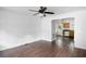 Living room with dark hardwood floors and ceiling fan at 2201 John Henry Ln., Myrtle Beach, SC 29579