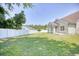 Large backyard with a well maintained lawn and a white picket fence at 2513 Hunters Trail, Myrtle Beach, SC 29588