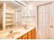 Bathroom featuring double sinks and a large mirror and linen shelving at 2513 Hunters Trail, Myrtle Beach, SC 29588
