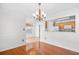Dining area with hardwood floors, chandelier, and open concept floor plan at 2513 Hunters Trail, Myrtle Beach, SC 29588