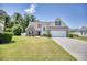 Charming two-story home with brick accents, manicured lawn, and a two-car garage on a sunny day at 2513 Hunters Trail, Myrtle Beach, SC 29588