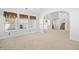Bright living room featuring multiple windows, carpeted floors, high ceilings, and light brown window coverings at 2513 Hunters Trail, Myrtle Beach, SC 29588