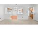 Open-concept space with hardwood dining room and kitchen views, flowing from the carpeted living area at 2513 Hunters Trail, Myrtle Beach, SC 29588